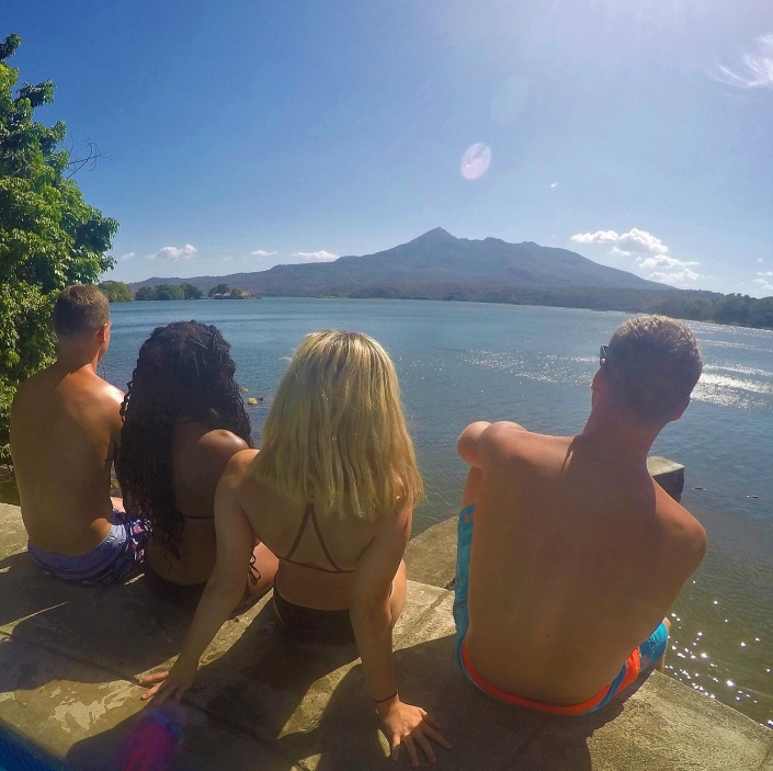 Clayton, Sep’tisha, Maria, and Alex relaxing across from Ometepe Island and Concepción Volcano as part of the program’s international trip to Nicaragua.