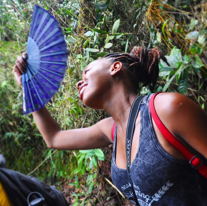, A little wind goes a long way in the dense tropical forest of Tapantí National Park. Regina from Kalamazoo comes prepared.